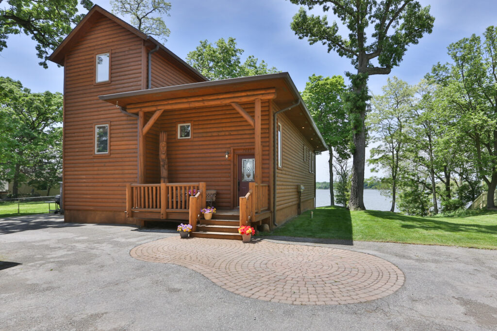 Front Driveway Entrance of Log Home On Cedar Lake